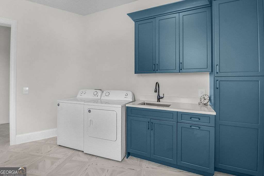 20 Taylor Street Tybee Island, GA 31328 - Photo 42 of 85 a utility room with cabinets washer and dryer
