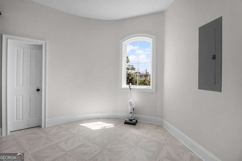 20 Taylor Street Tybee Island, GA 31328 - Photo 43 of 85 an empty room with windows and closet