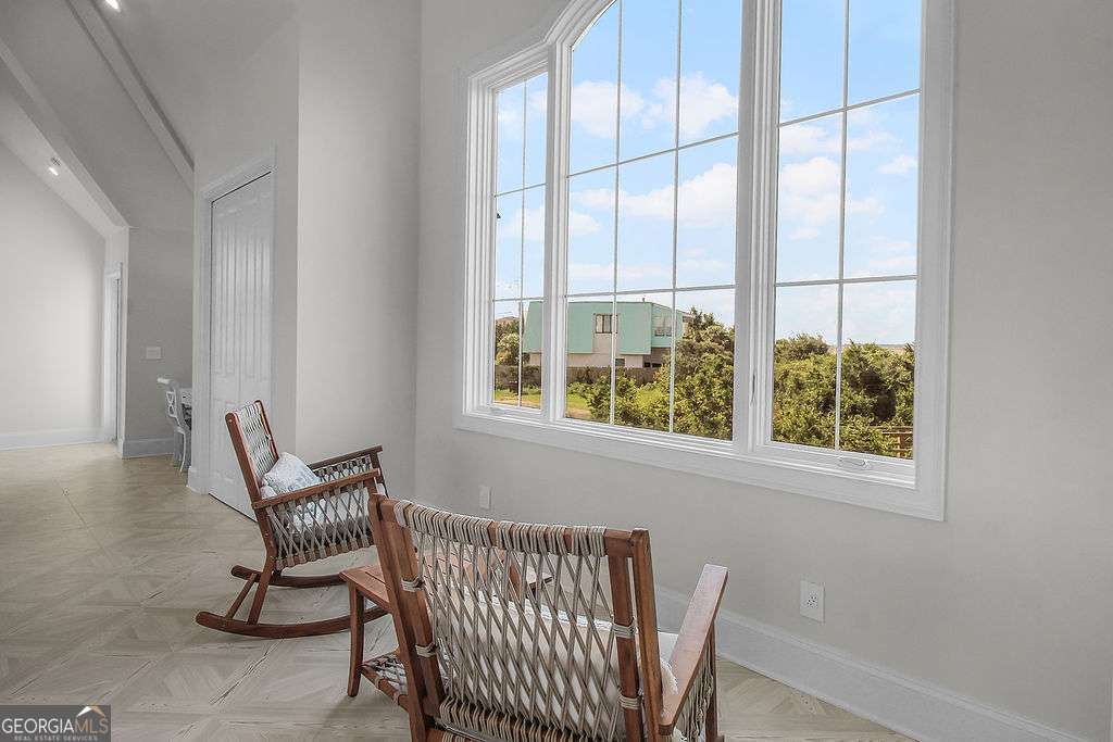 20 Taylor Street Tybee Island, GA 31328 - Photo 55 of 85 a view of a chair and window