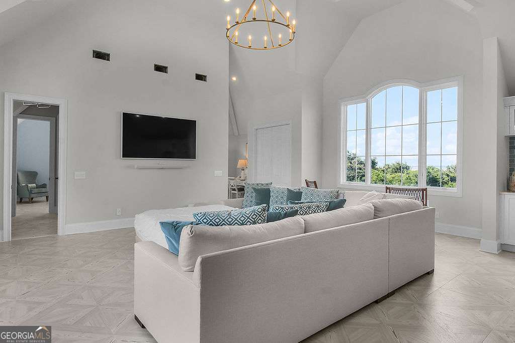 20 Taylor Street Tybee Island, GA 31328 - Photo 56 of 85 a living room with furniture and a flat screen tv