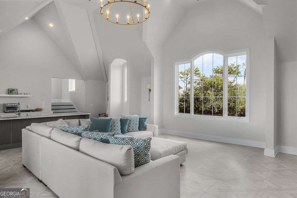 20 Taylor Street Tybee Island, GA 31328 - Photo 62 of 85 a living room with furniture and a large window