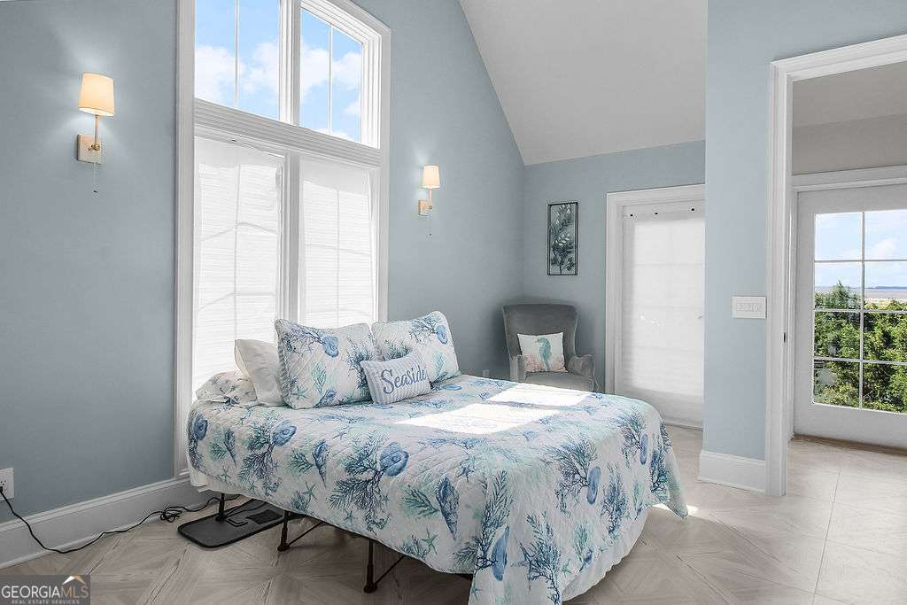 20 Taylor Street Tybee Island, GA 31328 - Photo 65 of 85 a bedroom with a bed and a window