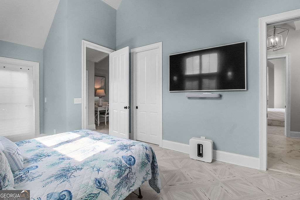 20 Taylor Street Tybee Island, GA 31328 - Photo 67 of 85 a bedroom with a bed and a flat screen tv