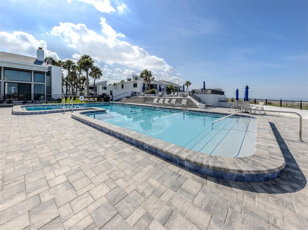 1555 Tarpon Center Drive, Unit 140 Venice, FL 34285 - Photo 34 of 60 a view of a swimming pool and lounge chair