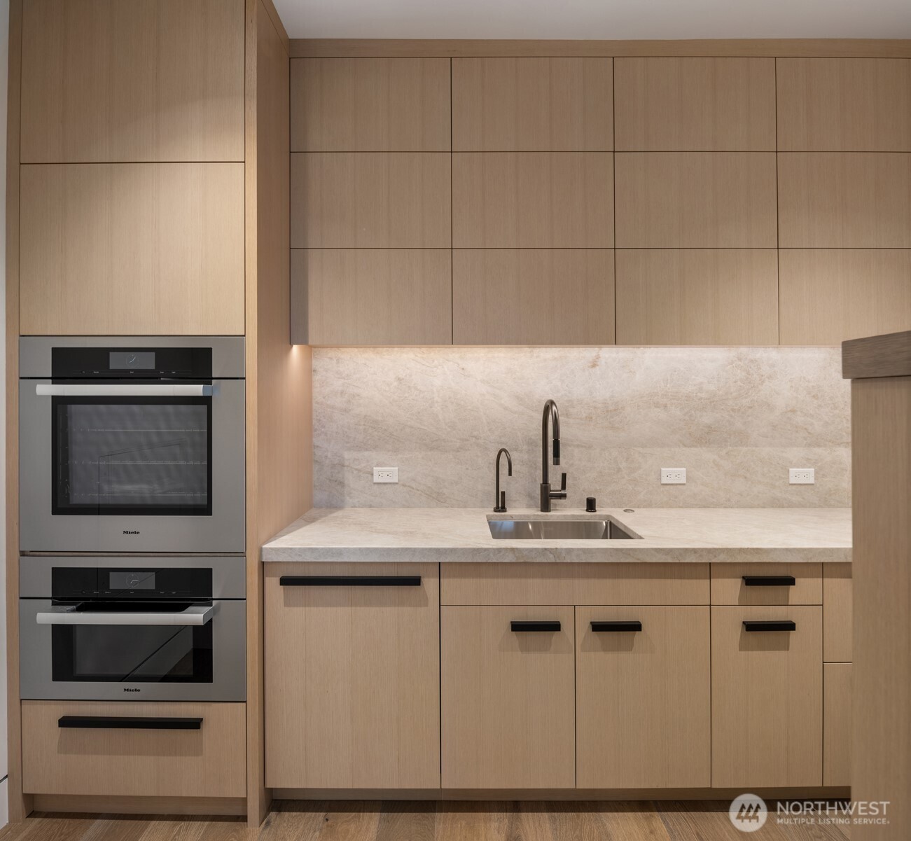 8 100th Avenue Northeast, Unit 201 Bellevue, WA 98004 - Photo 14 of 35 a kitchen with a sink stainless steel appliances and cabinets