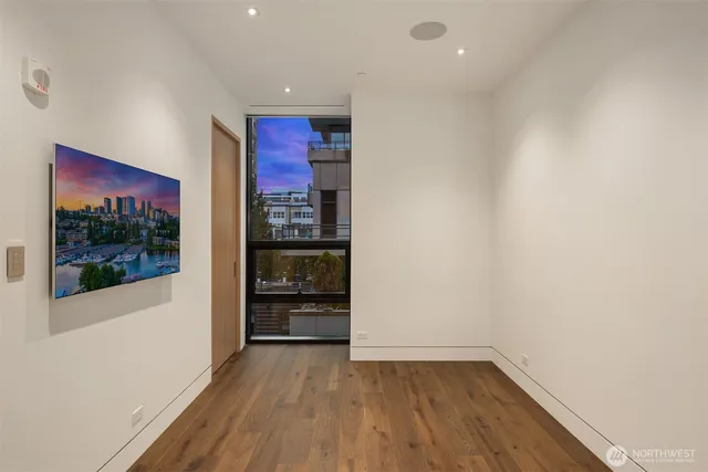 a view of a room with wooden floor and closet