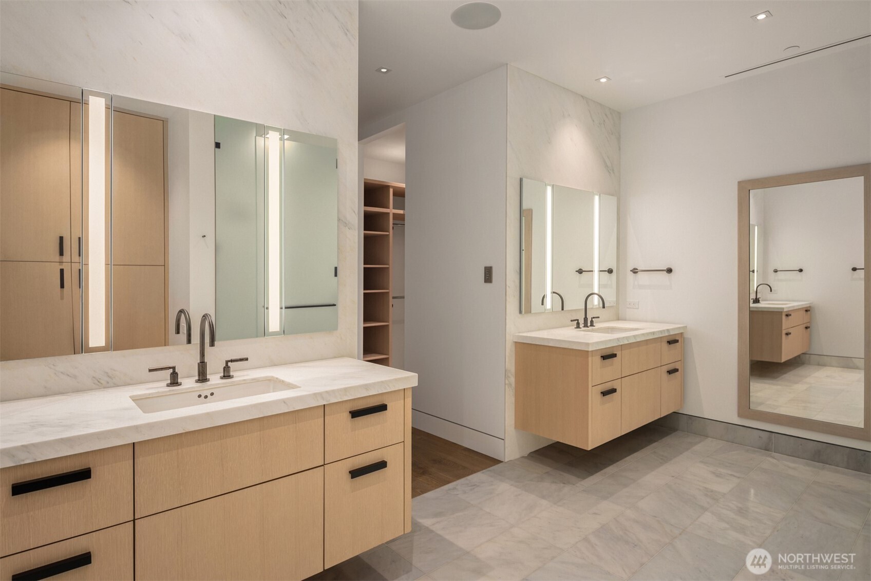 8 100th Avenue Northeast, Unit 201 Bellevue, WA 98004 - Photo 16 of 35 a bathroom with double vanity sink and mirror