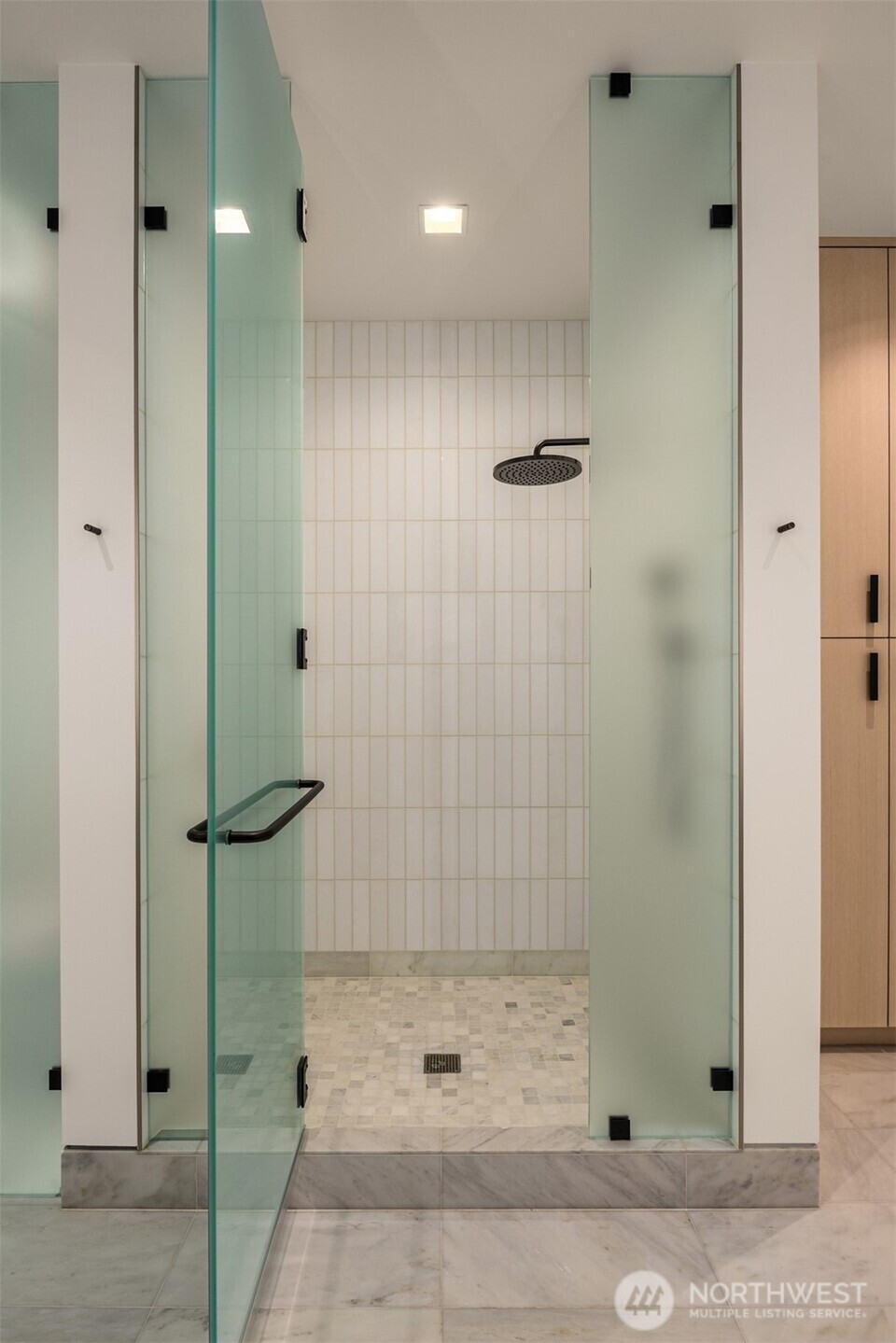 8 100th Avenue Northeast, Unit 201 Bellevue, WA 98004 - Photo 17 of 35 a bathroom with a shower