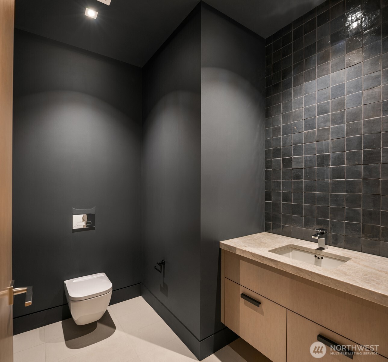 8 100th Avenue Northeast, Unit 201 Bellevue, WA 98004 - Photo 24 of 35 a bathroom with a toilet a sink and mirror