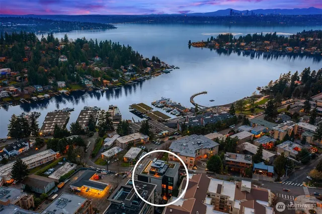 a view of a street with cars parked