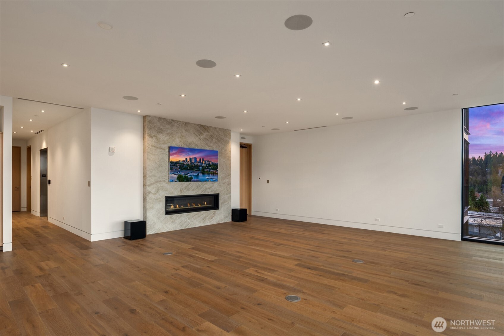 8 100th Avenue Northeast, Unit 201 Bellevue, WA 98004 - Photo 8 of 35 a view of a living room with hardwood floor and a flat screen tv