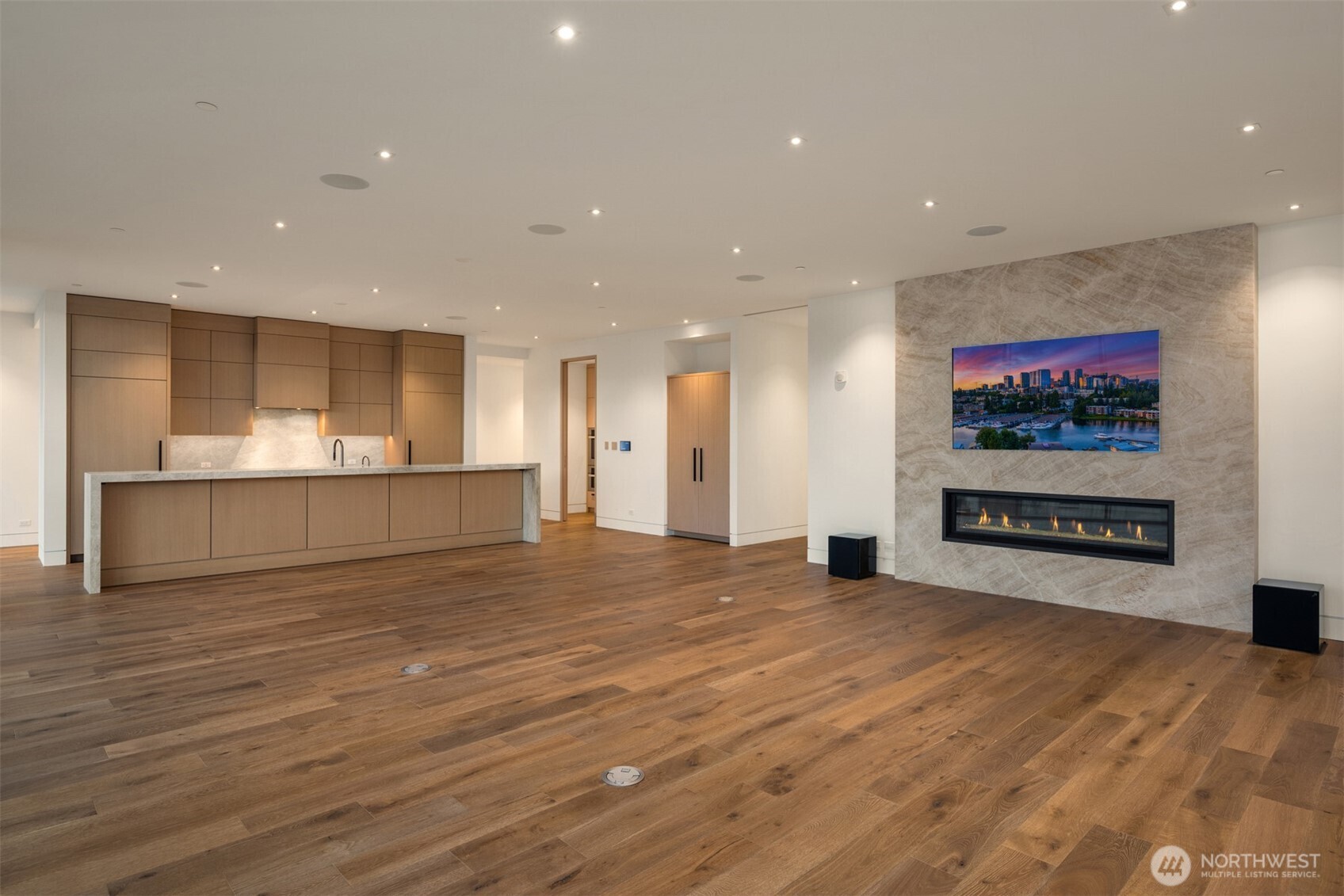 8 100th Avenue Northeast, Unit 201 Bellevue, WA 98004 - Photo 9 of 35 a view of a big room with wooden floor and windows