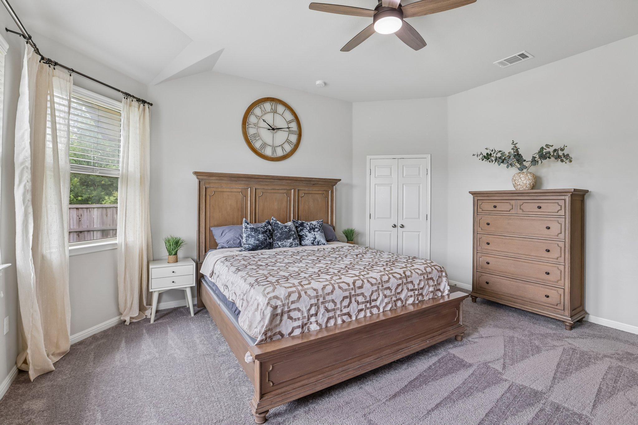6801 Banff Cove Austin, TX 78754 - Photo 17 of 37 Comfortable primary bedroom with high ceilings and a ceiling fan