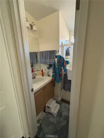 a bedroom with bed and window