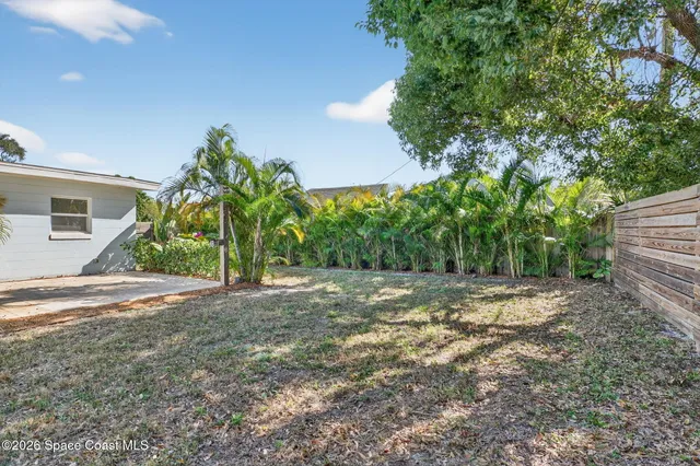 a view of a yard and a house