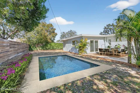 a bathroom with a shower a toilet and a sink