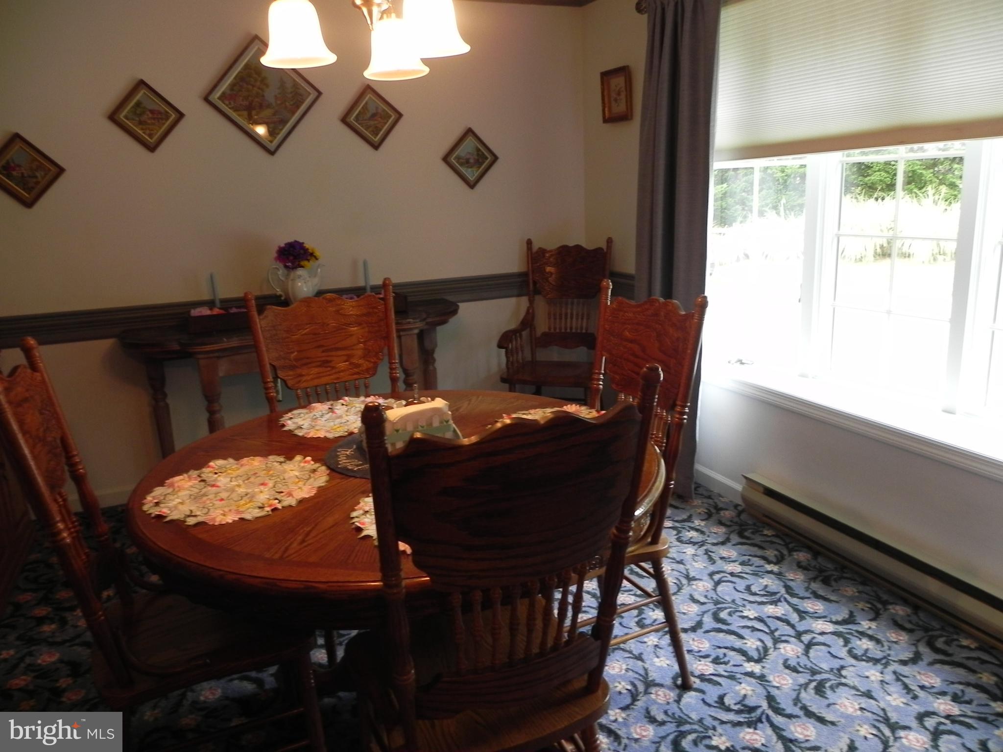 4285 Glory Road Bealeton, VA 22712 - Photo 21 of 76 a view of a dining room with furniture and wooden floor
