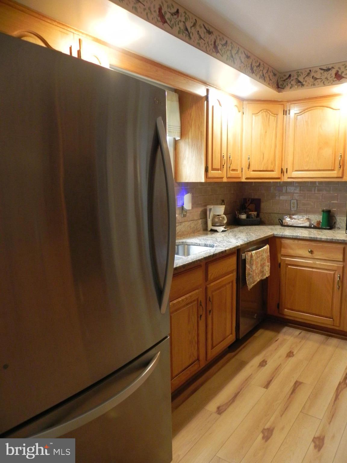 4285 Glory Road Bealeton, VA 22712 - Photo 23 of 76 a kitchen with a sink refrigerator and cabinets