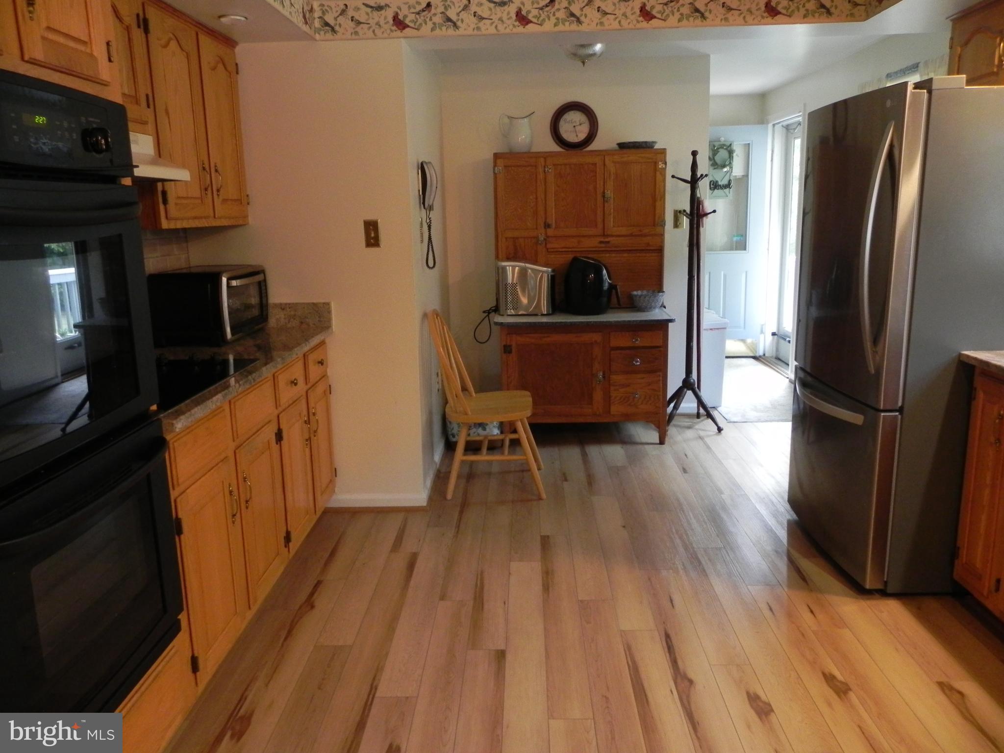 4285 Glory Road Bealeton, VA 22712 - Photo 26 of 76 a kitchen with stainless steel appliances a refrigerator and a stove top oven