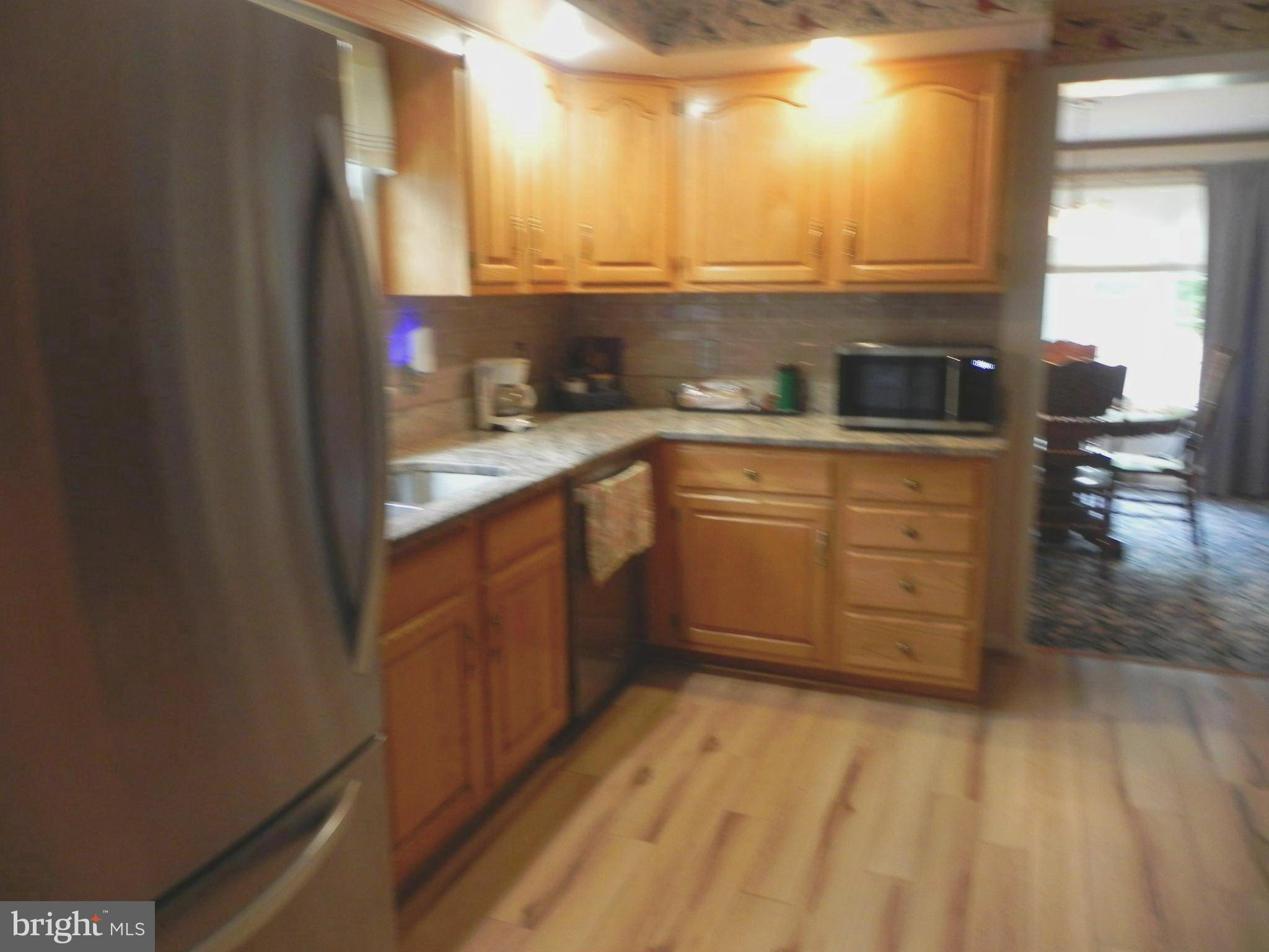 4285 Glory Road Bealeton, VA 22712 - Photo 28 of 76 a kitchen with stainless steel appliances granite countertop a sink stove and cabinets
