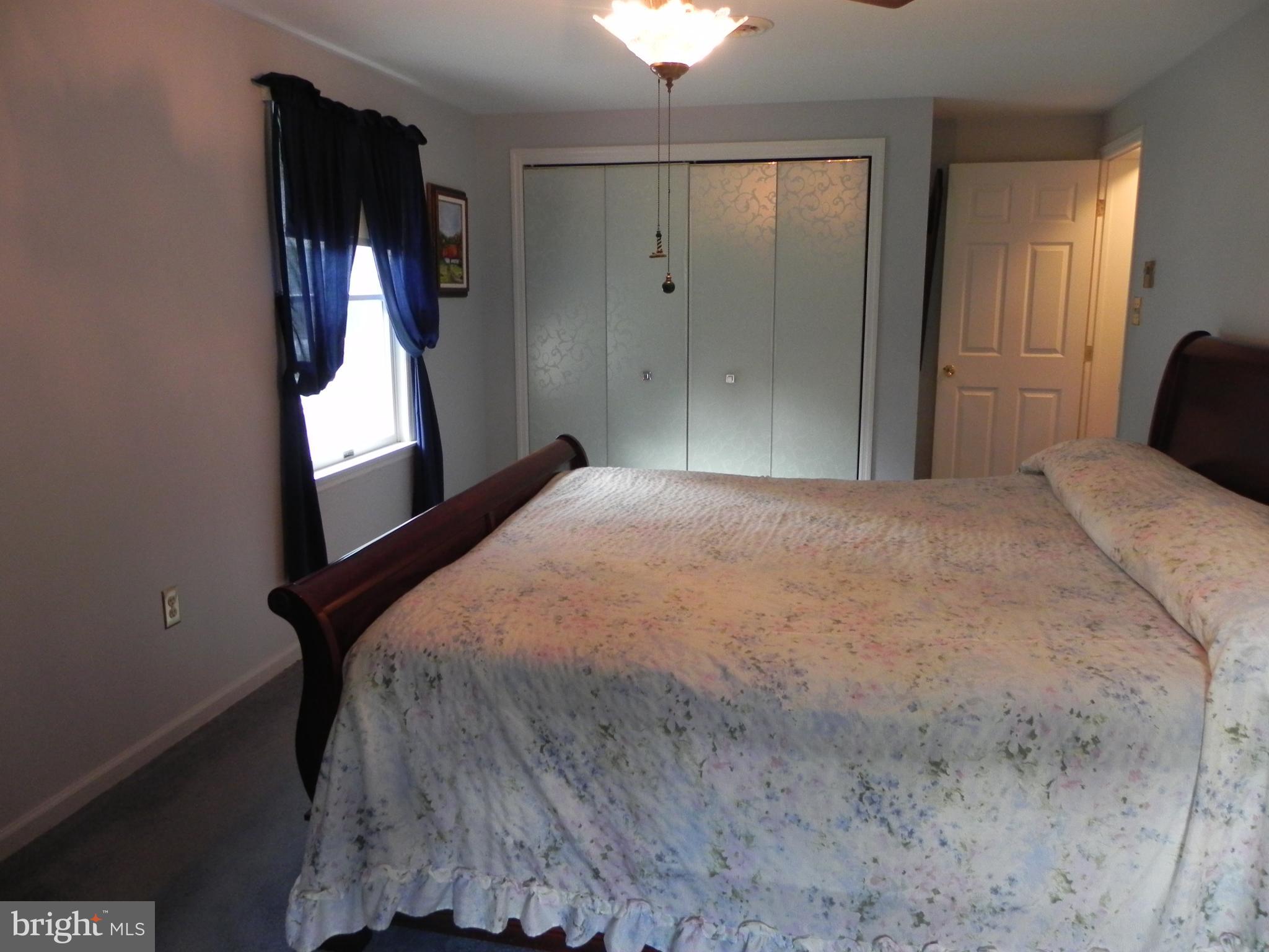 4285 Glory Road Bealeton, VA 22712 - Photo 39 of 76 a bedroom with a bed and a mirror