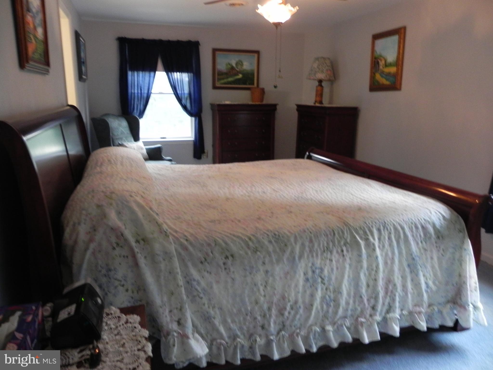 4285 Glory Road Bealeton, VA 22712 - Photo 40 of 76 a bedroom with a bed mirror and a window