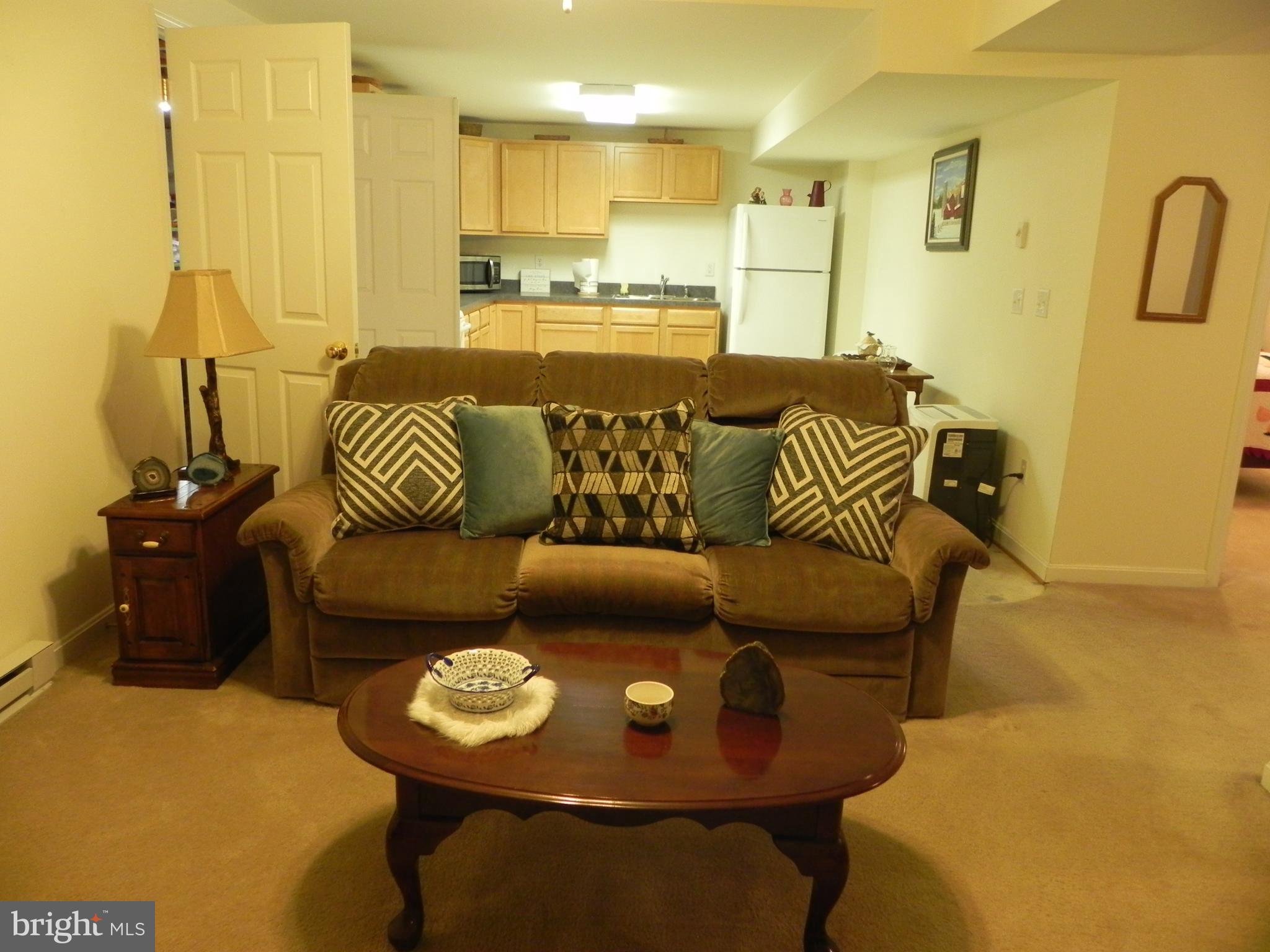 4285 Glory Road Bealeton, VA 22712 - Photo 46 of 76 a living room with furniture and a wooden floor