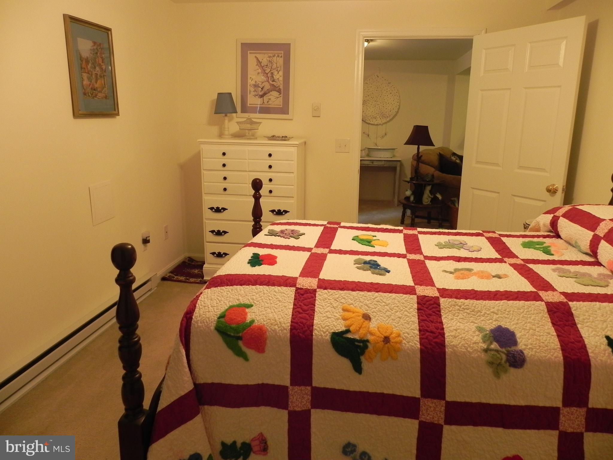 4285 Glory Road Bealeton, VA 22712 - Photo 58 of 76 a bed sitting in a bedroom next to a window