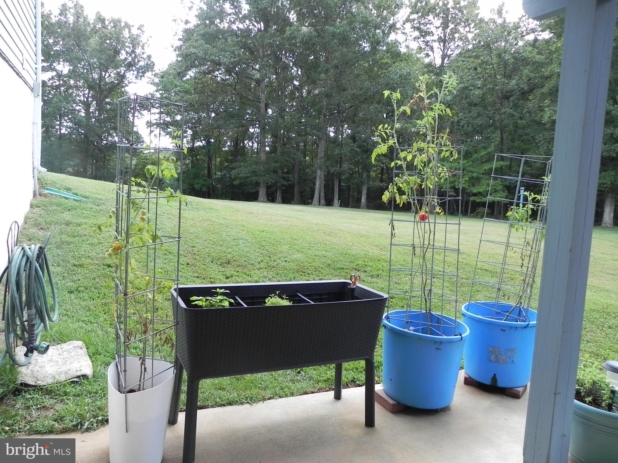 4285 Glory Road Bealeton, VA 22712 - Photo 72 of 76 a view of a chair and table in the back yard