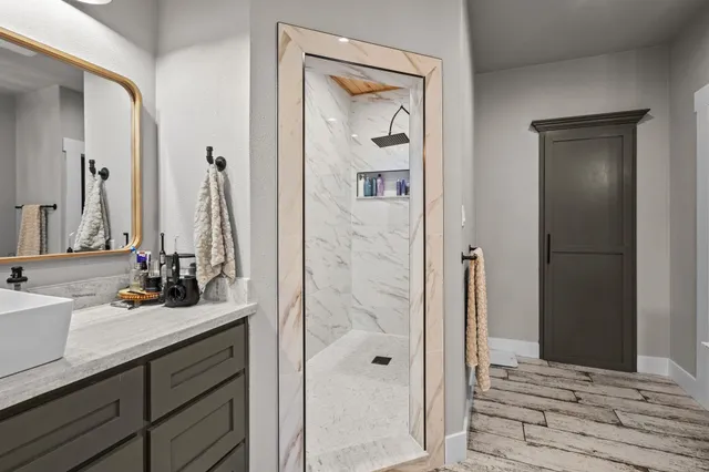 a bathroom with a sink and a mirror