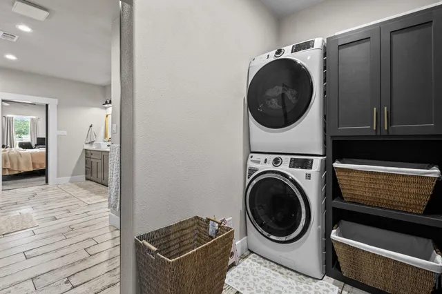 a view of a storage and utility room with washer and dryer