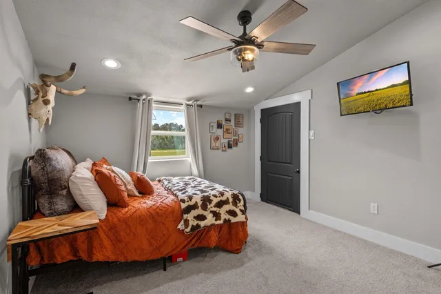 a bedroom with a bed and a table in it