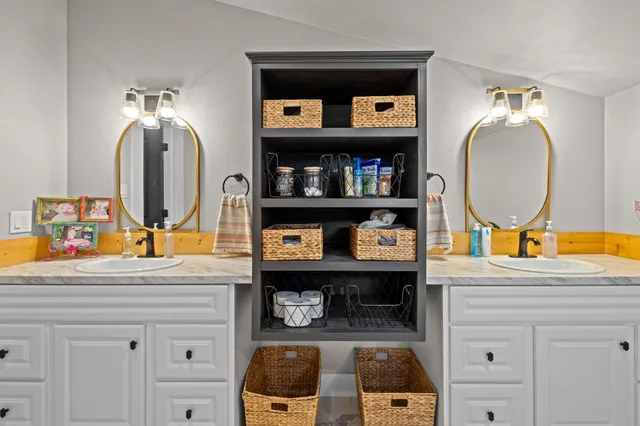 a bathroom with a sink and a mirror