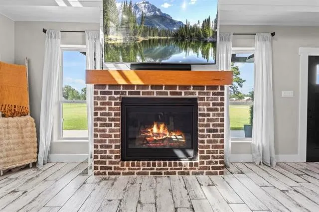 a room with fireplace and wooden floor