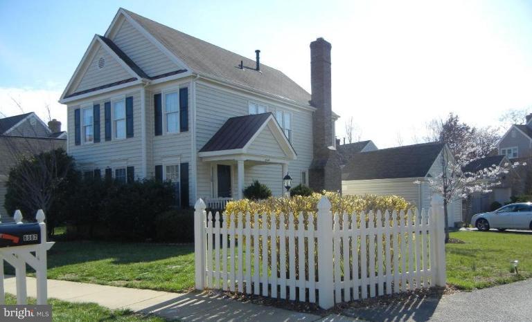 6568 Forsythia Street Springfield, VA 22150 - Photo 1 of 15 a front view of a house with garden