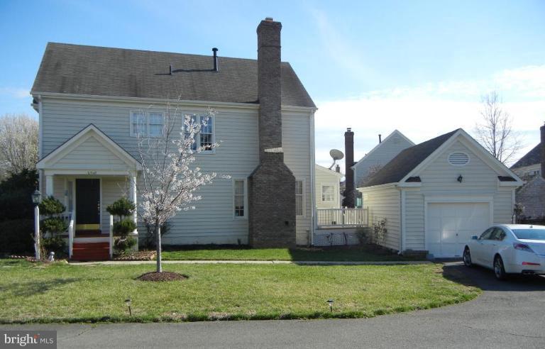 6568 Forsythia Street Springfield, VA 22150 - Photo 2 of 15 a front view of a house with a garden