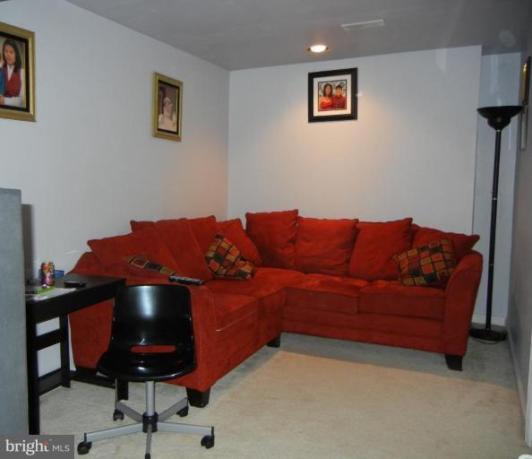 6568 Forsythia Street Springfield, VA 22150 - Photo 4 of 15 a living room with furniture