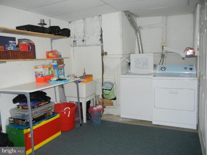 6568 Forsythia Street Springfield, VA 22150 - Photo 5 of 15 a room with storage and utility