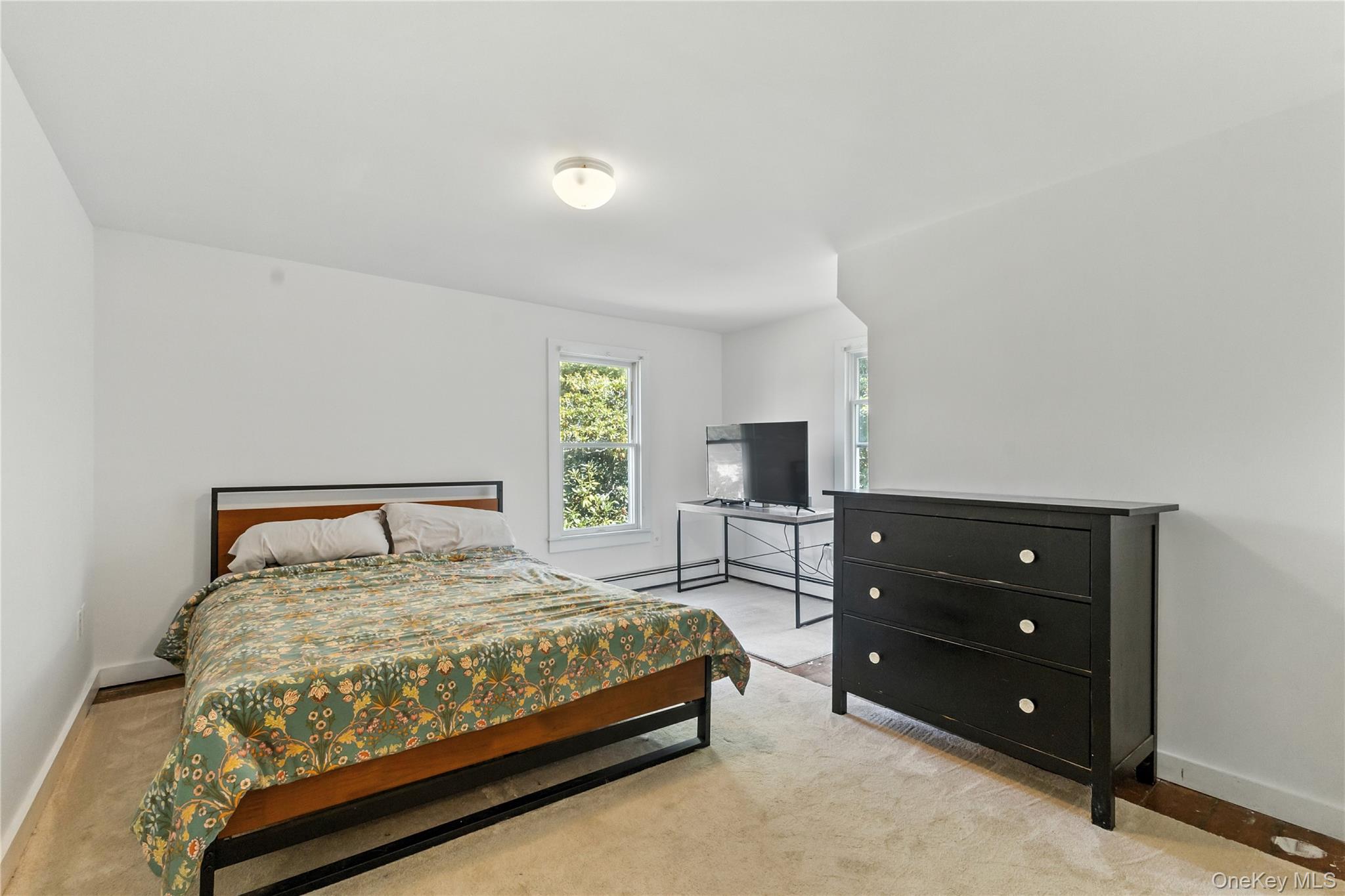 168 Gleneida Ridge Road Carmel, NY 10512 - Photo 20 of 48 a bedroom with a bed and a tv