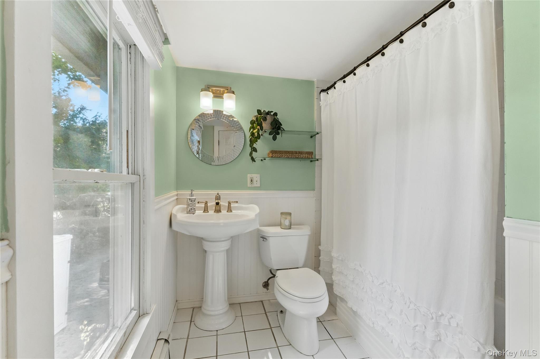 168 Gleneida Ridge Road Carmel, NY 10512 - Photo 27 of 48 a bathroom with a sink a toilet and a mirror