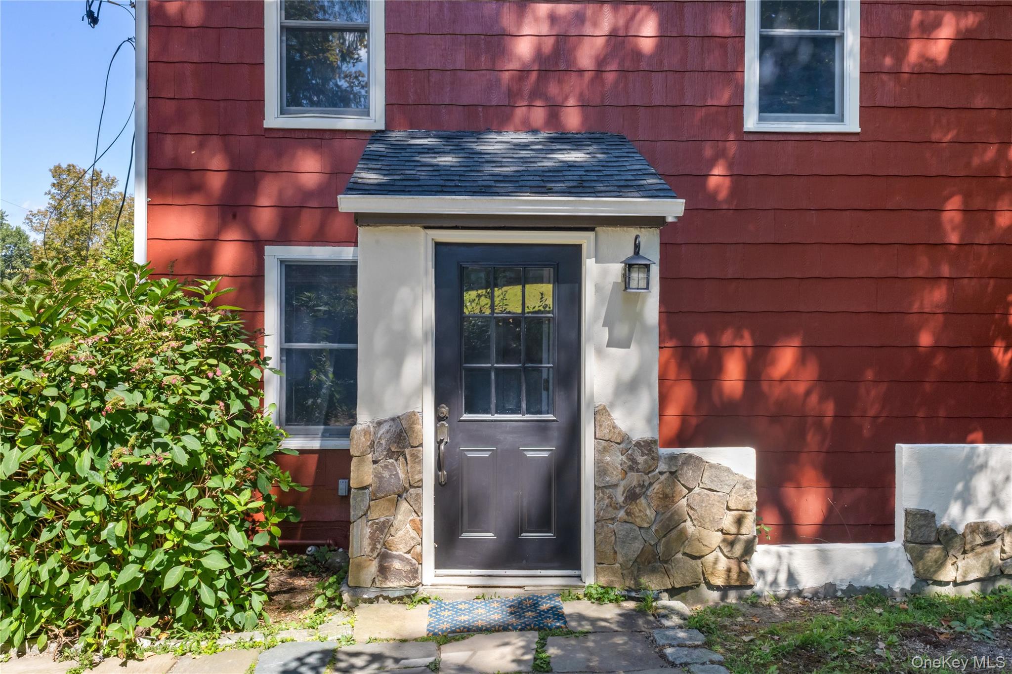168 Gleneida Ridge Road Carmel, NY 10512 - Photo 30 of 48 a building with potted plants in front of it