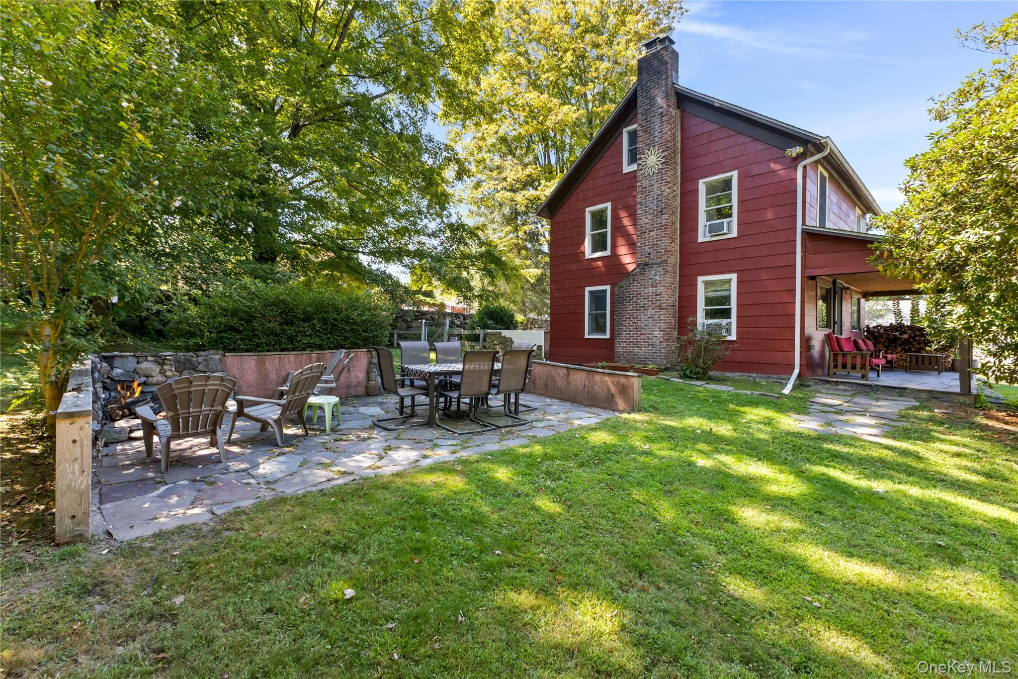 168 Gleneida Ridge Road Carmel, NY 10512 - Photo 36 of 48 a view of backyard of house with outdoor seating and green space