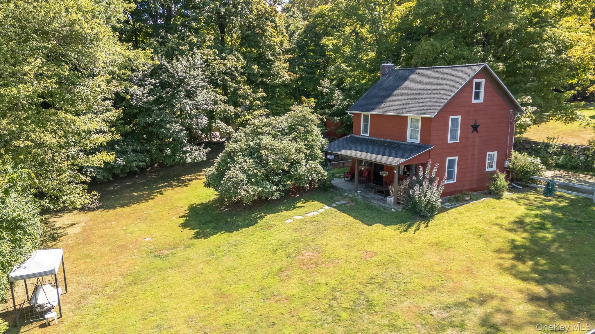 168 Gleneida Ridge Road Carmel, NY 10512 - Photo 40 of 48 a aerial view of a house with a yard table and chairs