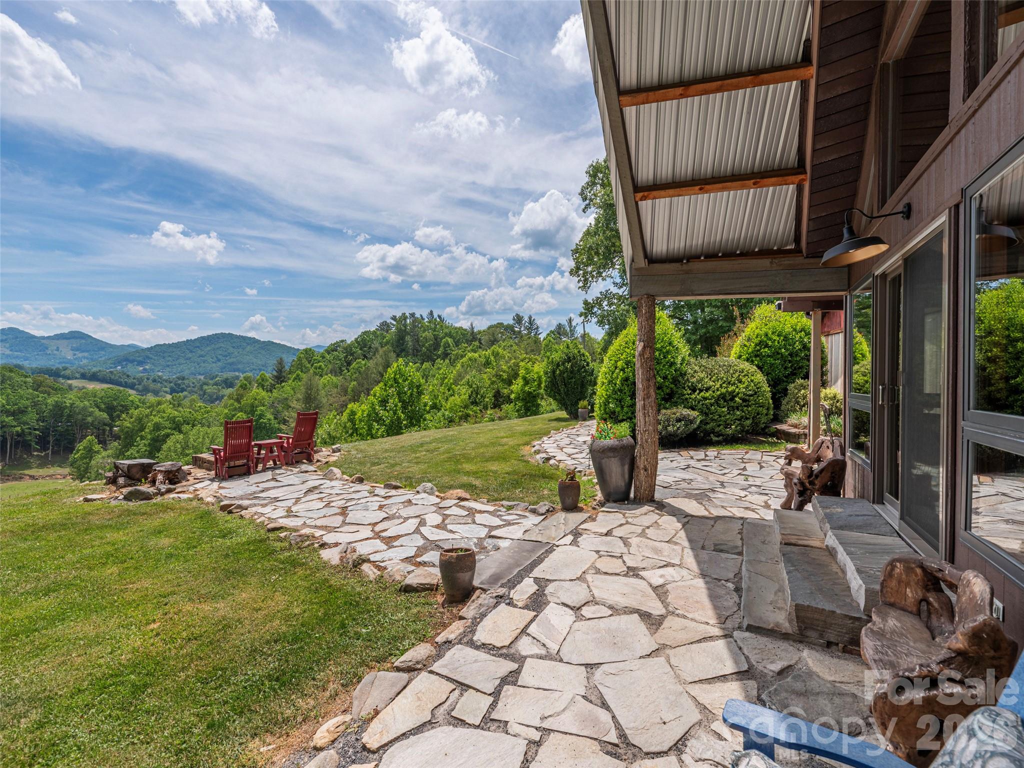 a view of yard with patio