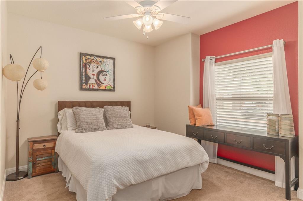 6708 Menchaca Road, Unit 14 Austin, TX 78745 - Photo 10 of 22 Warm neutral wall tones with a vibrant accent wall