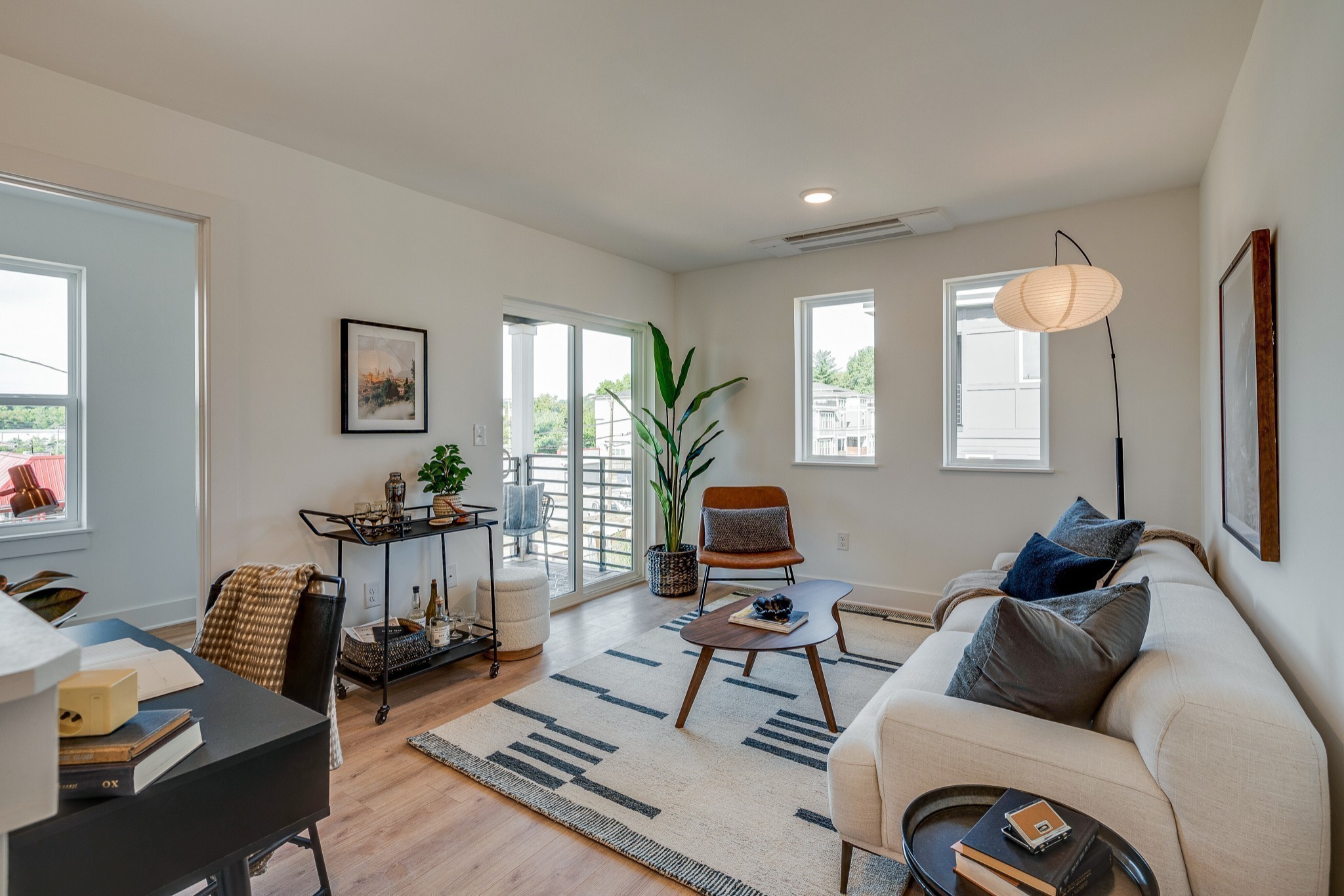 320 Mullberry Terrace, Unit A Madison, TN 37115 - Photo 17 of 26 a living room with furniture and a potted plant