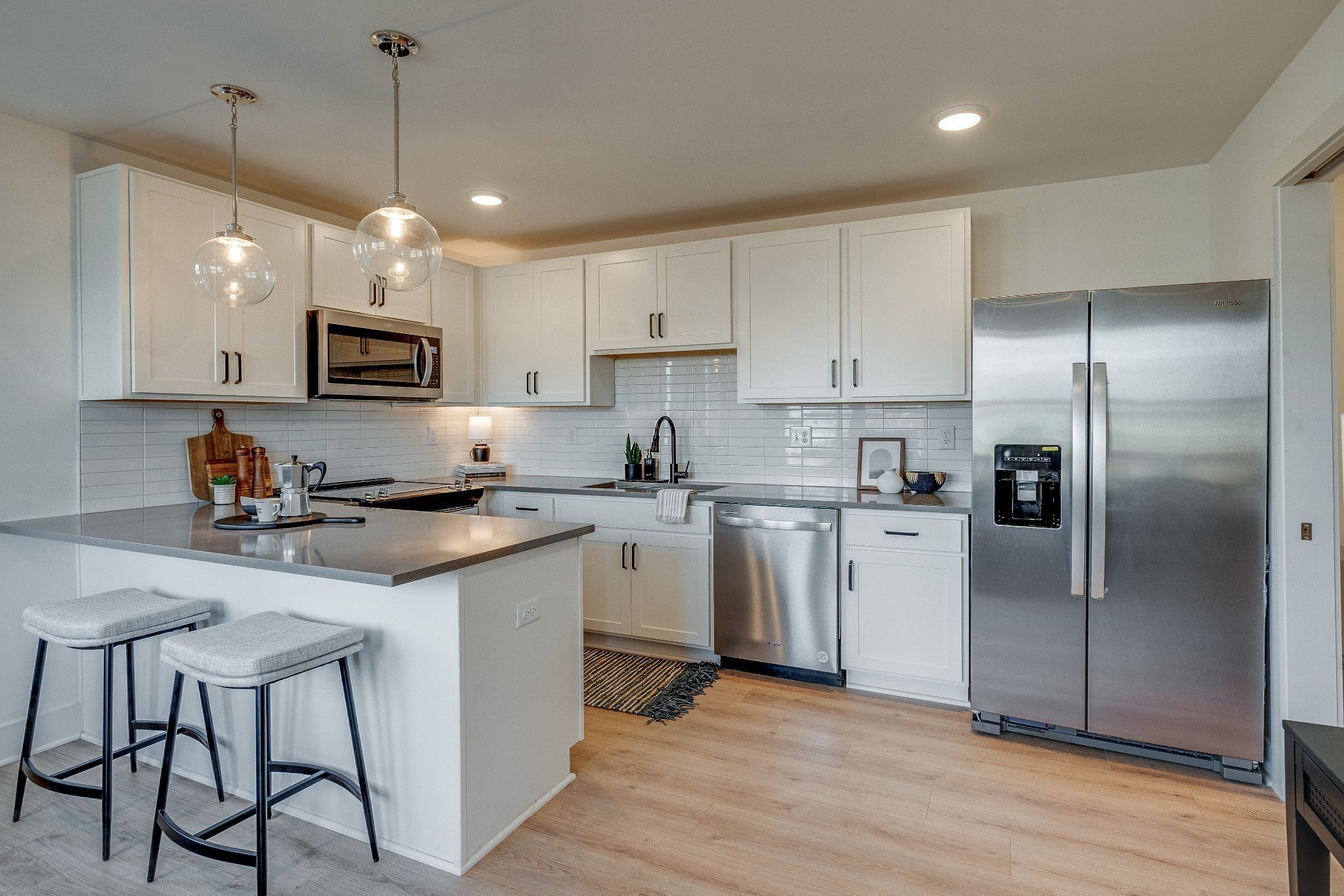 320 Mullberry Terrace, Unit A Madison, TN 37115 - Photo 5 of 26 a kitchen with kitchen island a counter space a sink appliances and cabinets