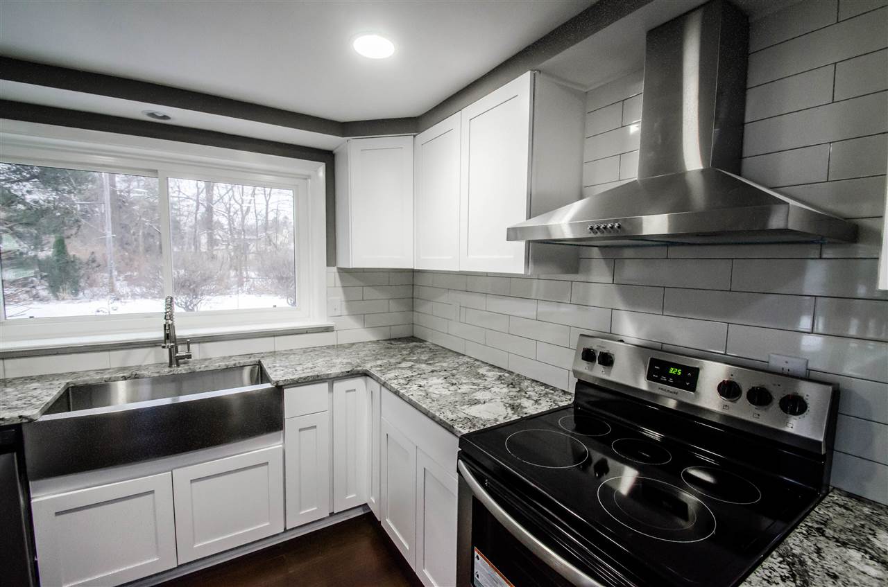 3209 North View Road Rockford, IL 61107 - Photo 11 of 25 a kitchen with a stove and a sink