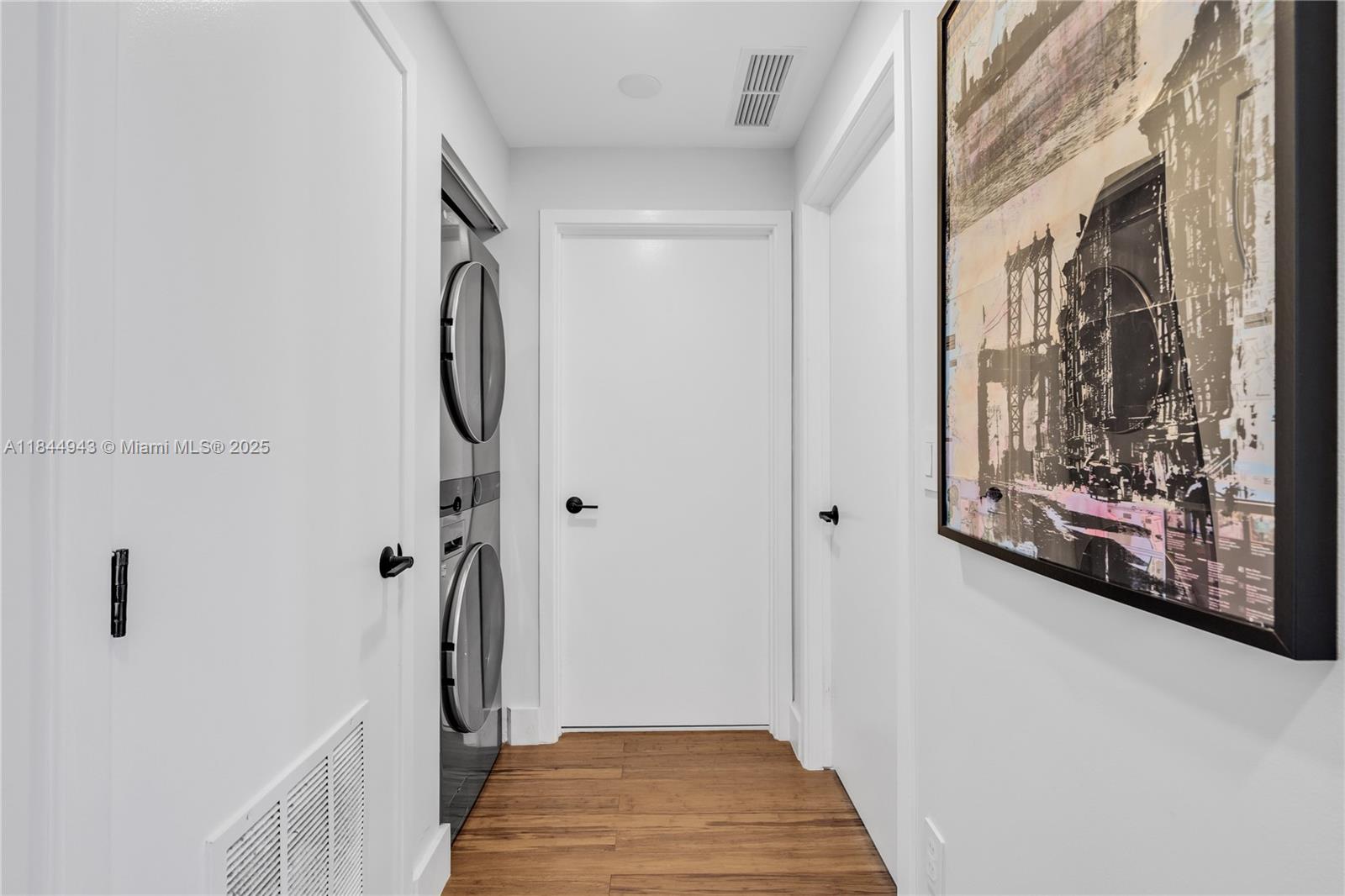 888 Biscayne Boulevard, Unit 812 Miami, FL 33132 - Photo 18 of 36 a view of a hallway with wooden floor and closet