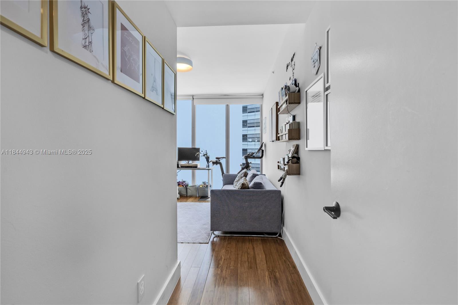 888 Biscayne Boulevard, Unit 812 Miami, FL 33132 - Photo 19 of 36 a view of living room with furniture and wooden floor